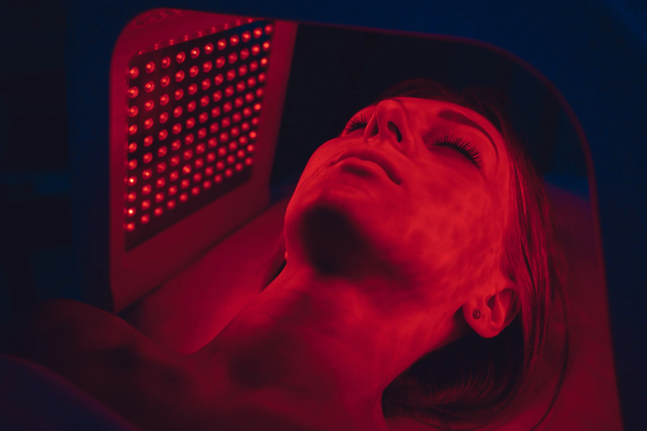 A woman is receiving Red Light Therapy Meridian, ID | Oasis Medspa And IV Bar